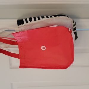Two Lululemon bags, red and white.